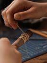 Person Holding Brown Wooden Stick