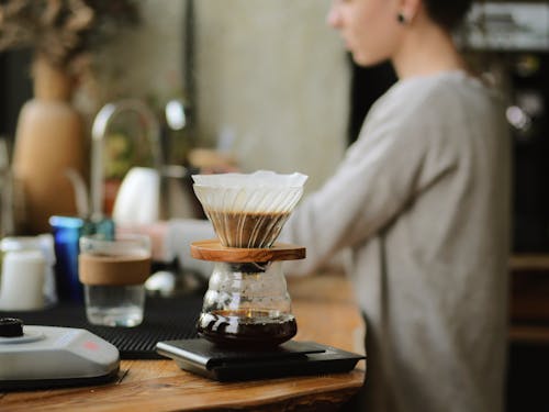 Free Clear Glass Cup on Brown Wooden Counter Top Stock Photo