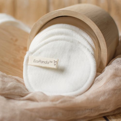 White Fabric Pads in a Bamboo Container