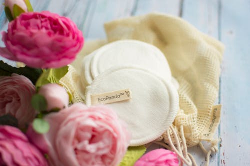 Round Cotton Pads Near the Flowers