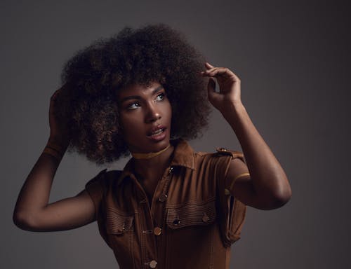 Woman in Brown Sleeveless Shirt