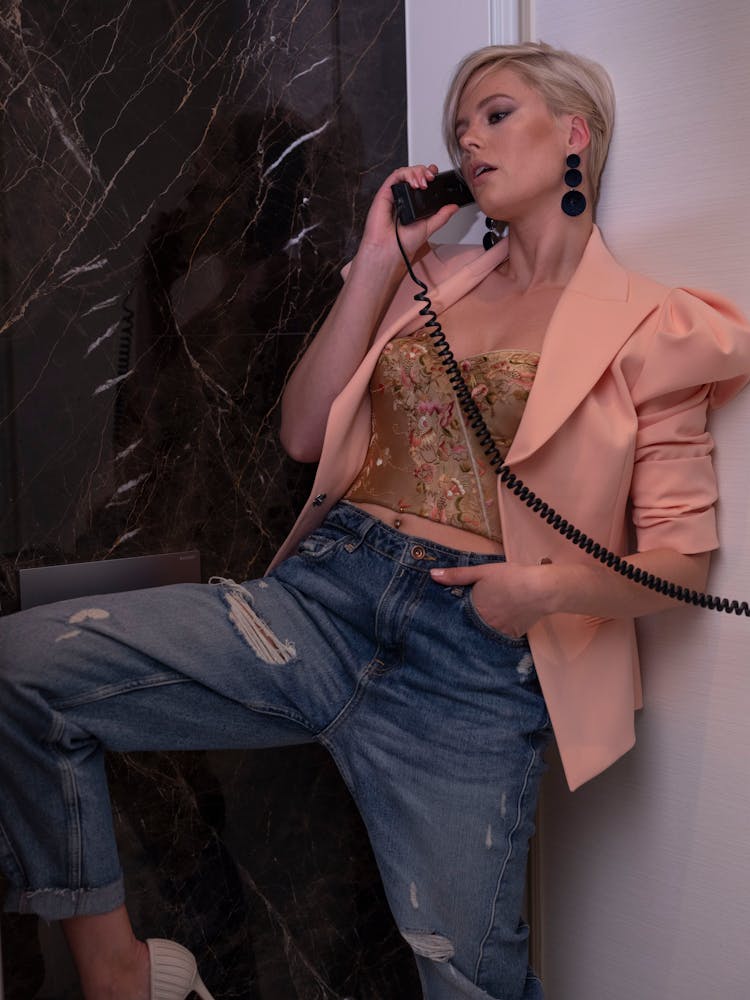 Confident Young Woman Having Conversation On Retro Phone