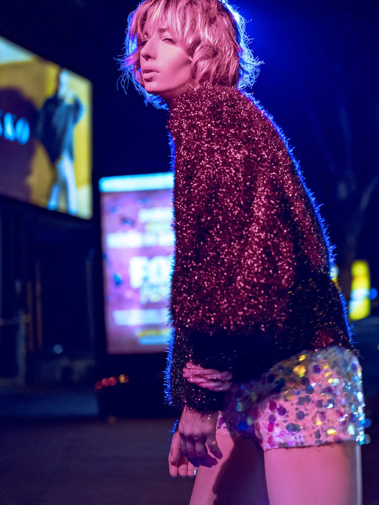 Sensual Young Woman Standing On Street At Night