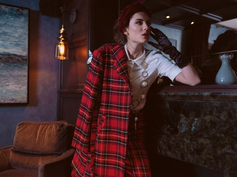 Stylish woman in trendy plaid clothes