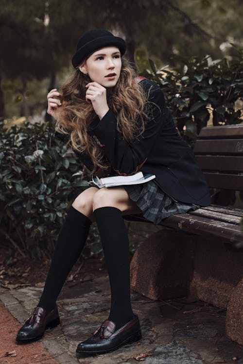 Young Woman in Black Bonnet and Blazer 