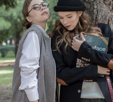 Students Holding Book
