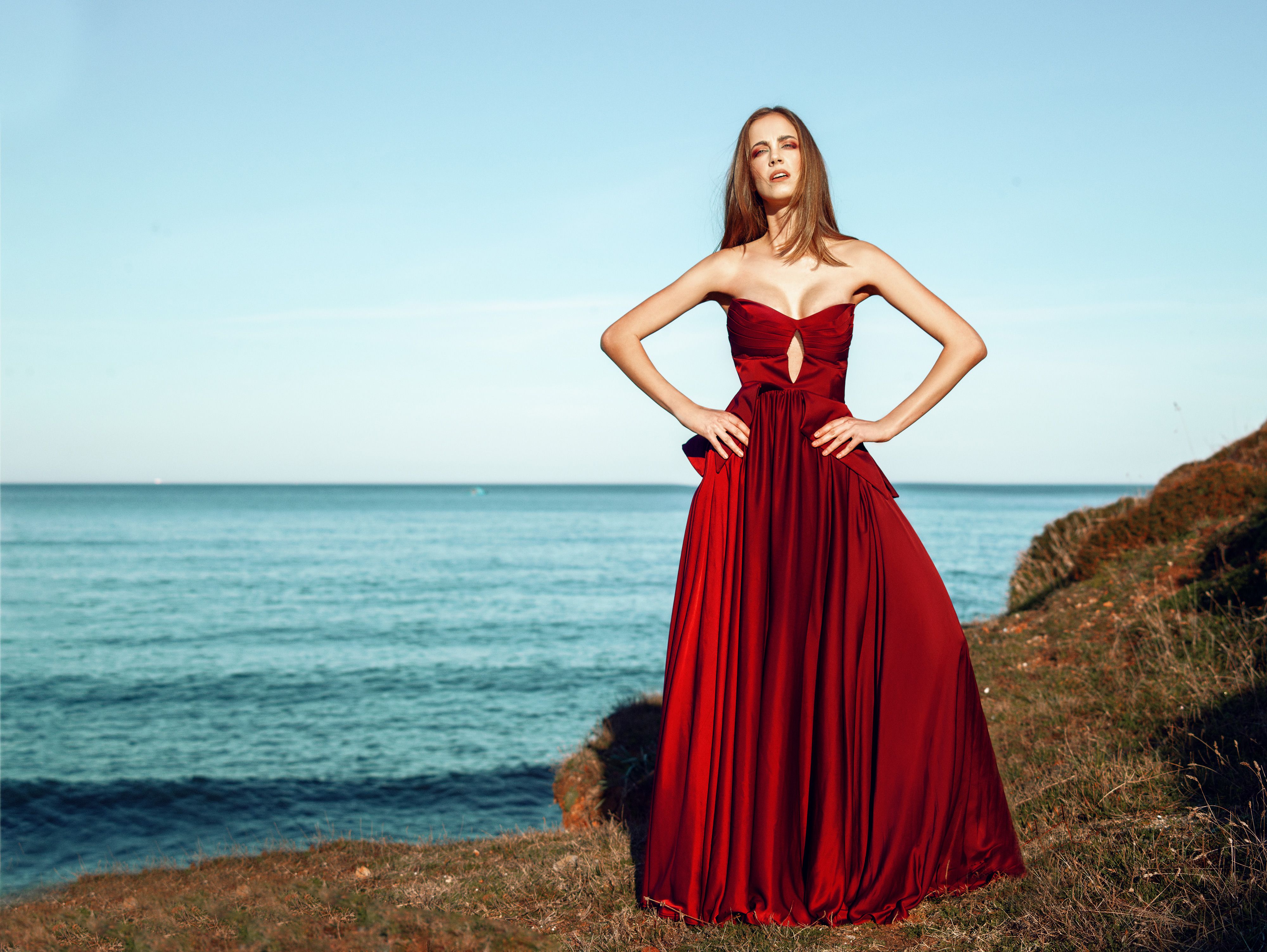 Woman in Red Dress Standing on Cliff · Free Stock Photo