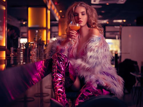 Woman in Fur Coat Holding Cocktail