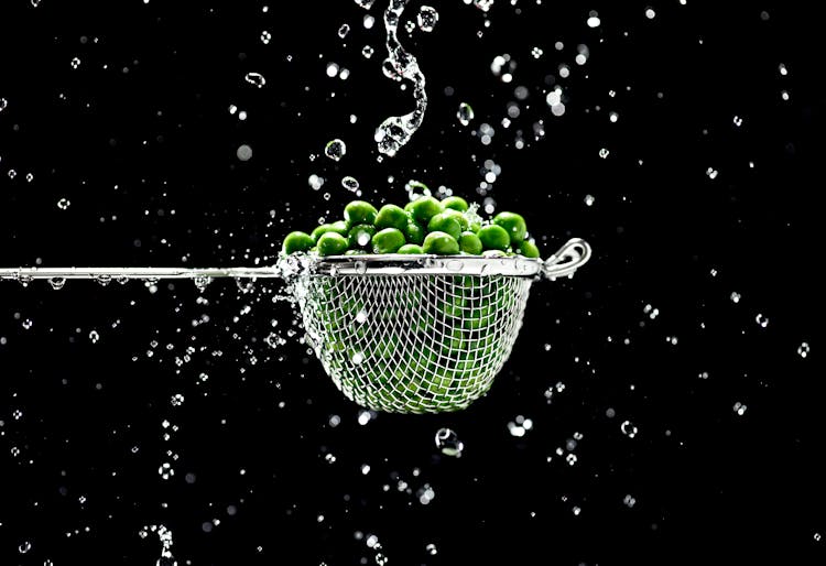 Green Fruits In Strainer