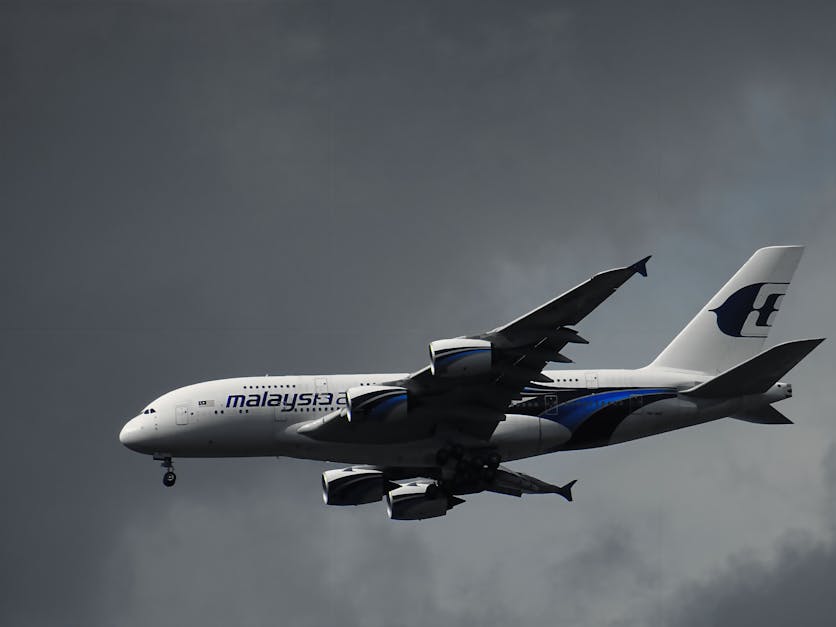 White Malaysian Airlines Under White Clouds