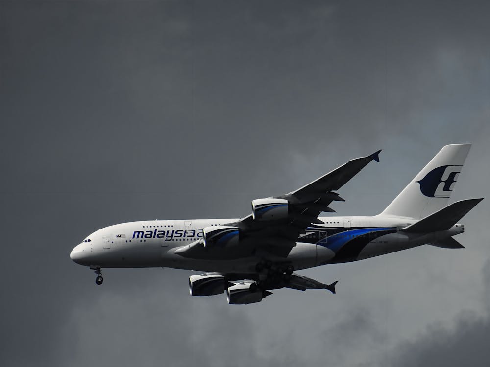 Free White Malaysian Airlines Under White Clouds Stock Photo
