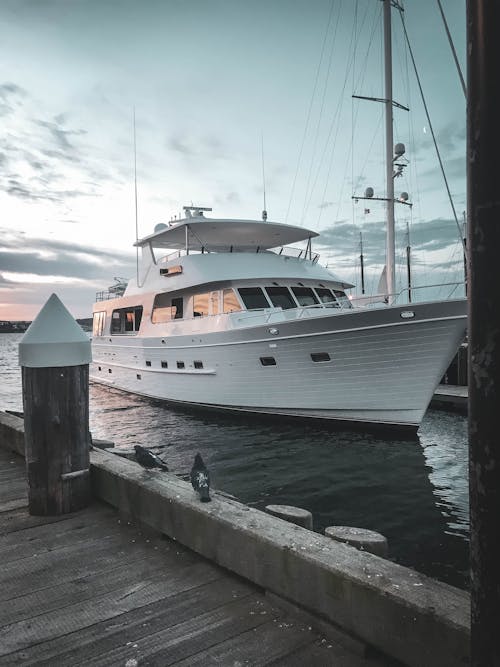 A Yacht Docked at the Harbor