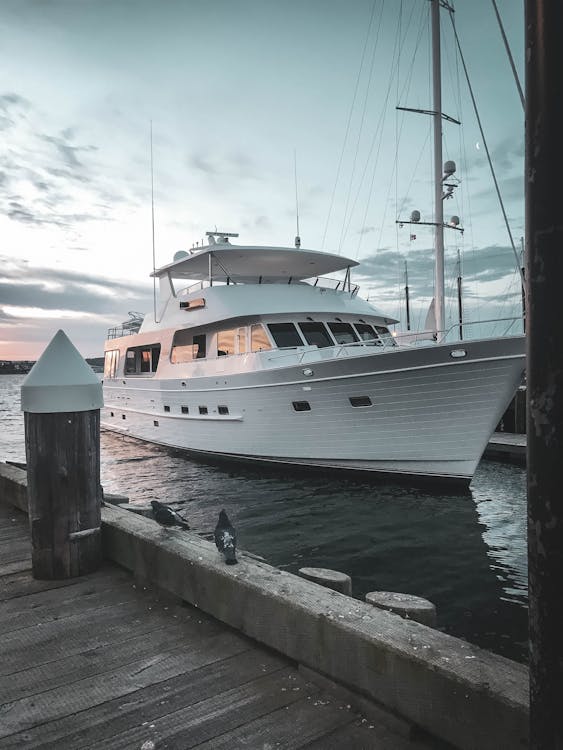 Free White and Blue Boat on Dock Stock Photo