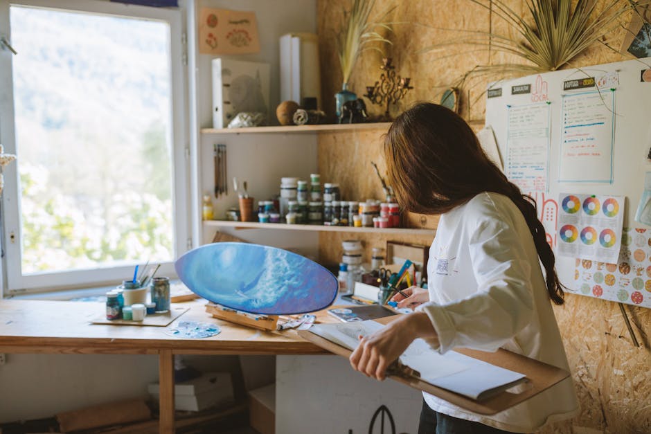 NordPass vs Bitwarden: Cross-Platform Autofill Showdown Woman artist painting a blue ocean scene on a skateboard in a cozy art studio.