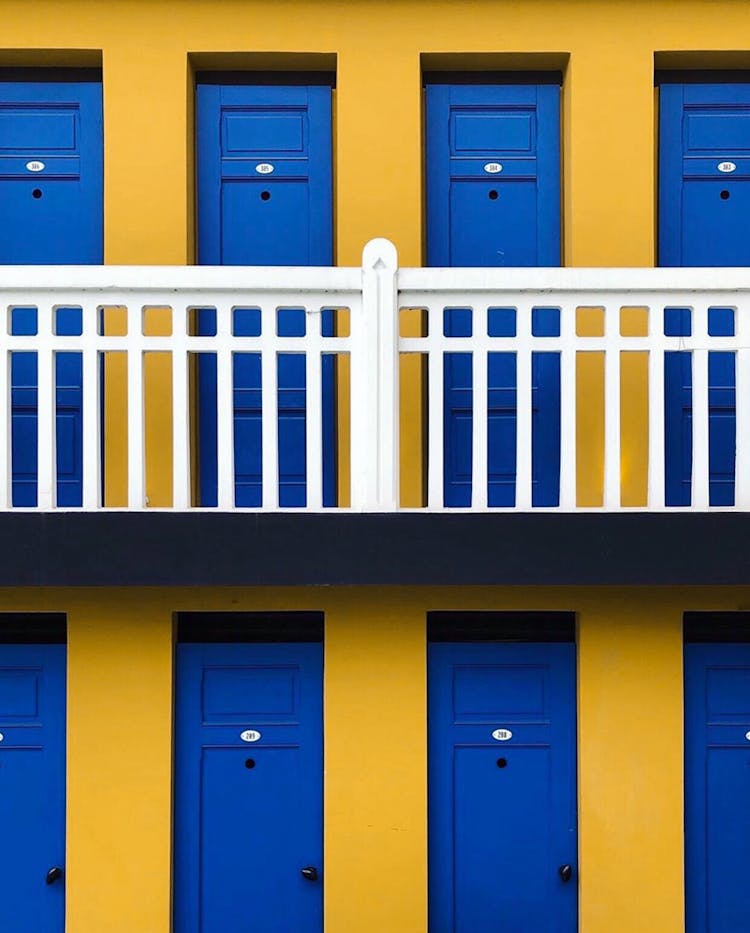 Row Of Blue Doors Of Residential Building