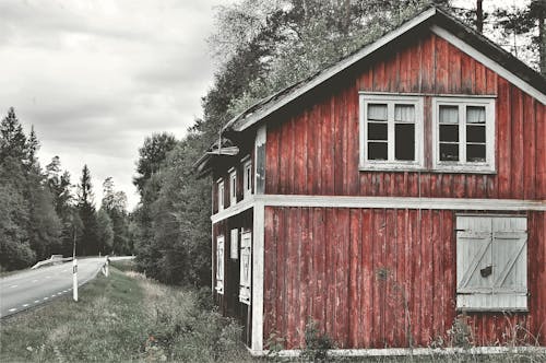 Brown Wooden House Near the Road