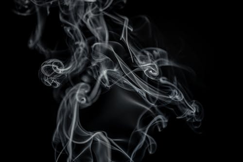 Free White Smoke in a Dark Setting Stock Photo
