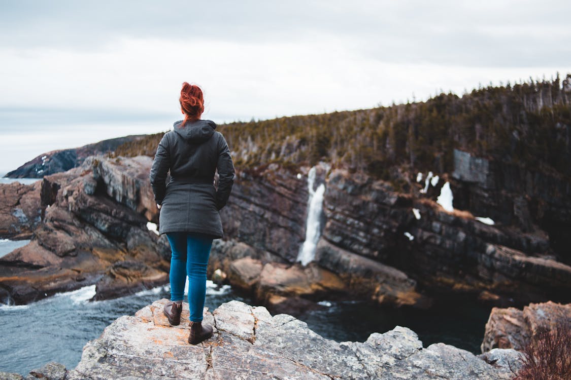 Free Photo of Woman Standing on Cliff Stock Photo