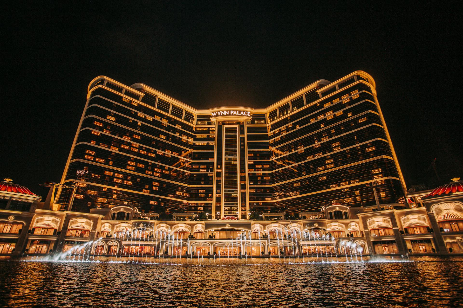 Capture of Wynn Palace with stunning night lighting and water fountain in Macau.