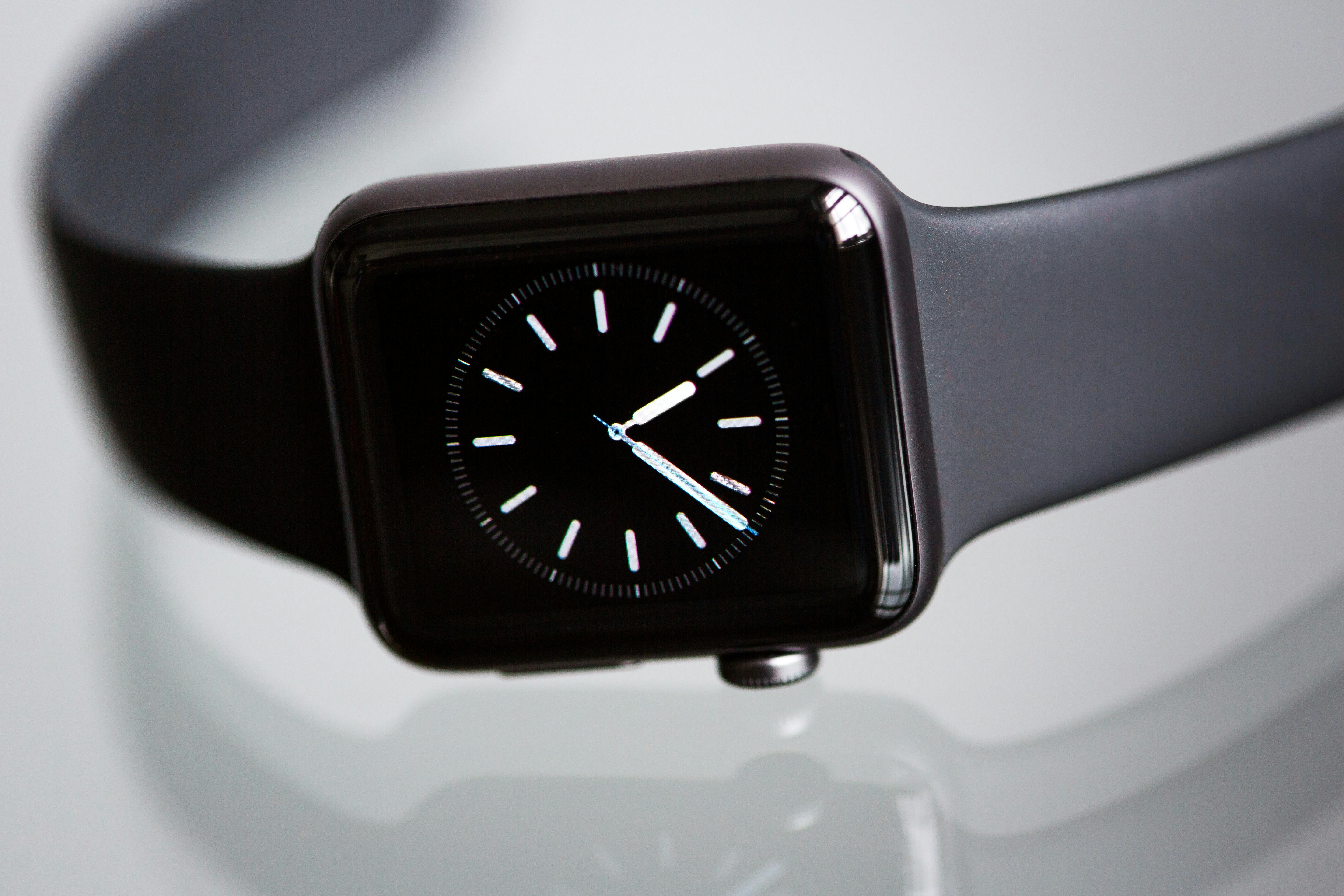 black apple watch with black sports band