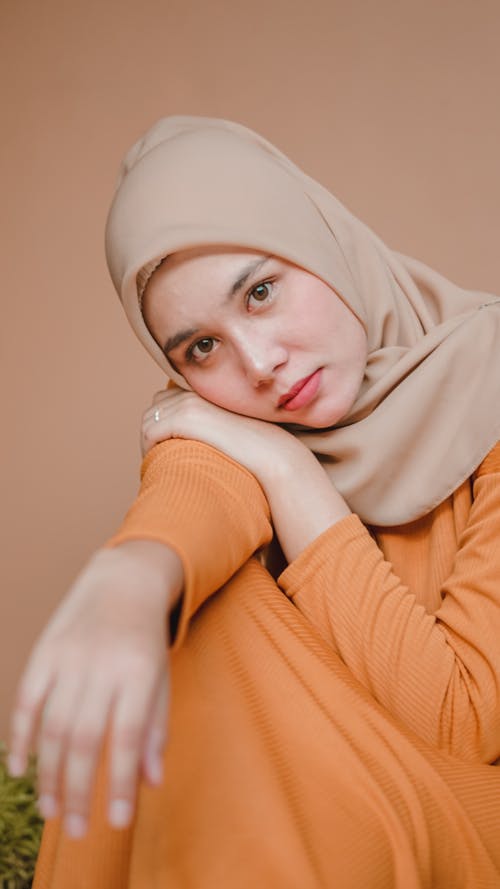 Woman in Orange Long Sleeve Shirt Wearing Hijab