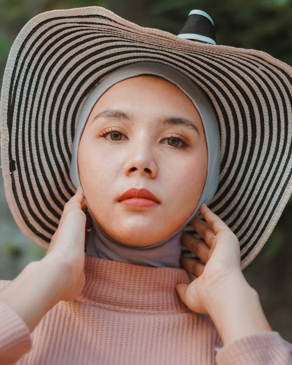 Photo of Woman Wearing Hijab and Sun Hat