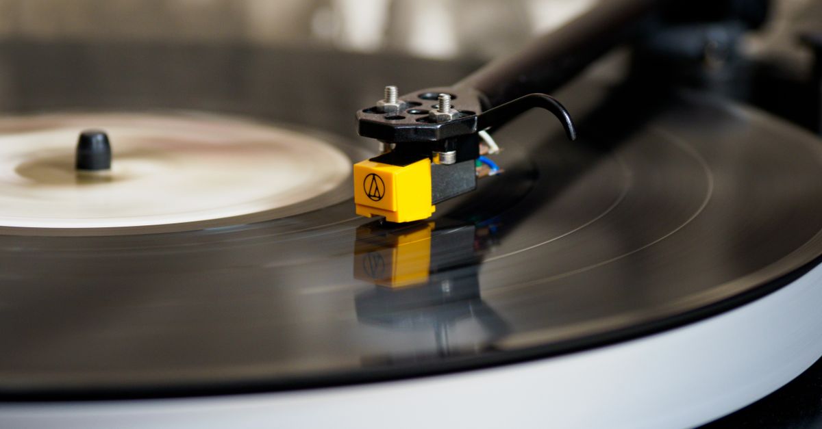 Close-up of a turntable needle dropping onto a vinyl record