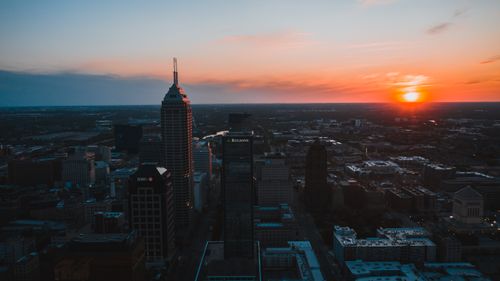 Free Aerial view of Indianapolis skyline at sunset with vibrant colors and urban landscape. Stock Photo