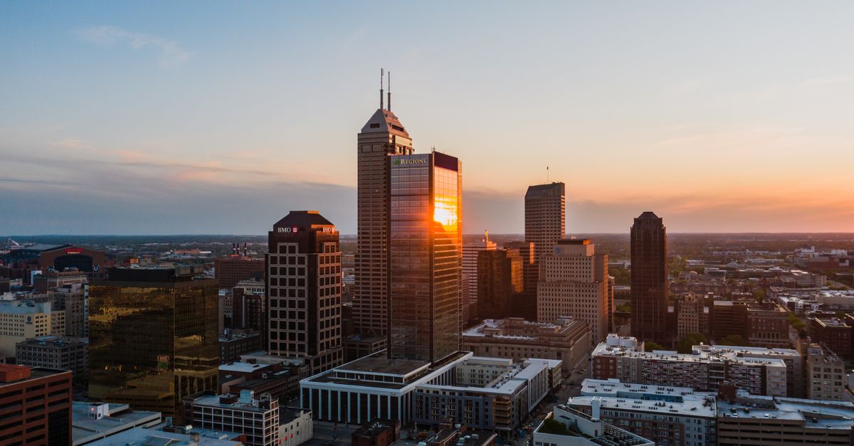 A stunning aerial view of Indianapolis, Indiana's skyline at sunset.