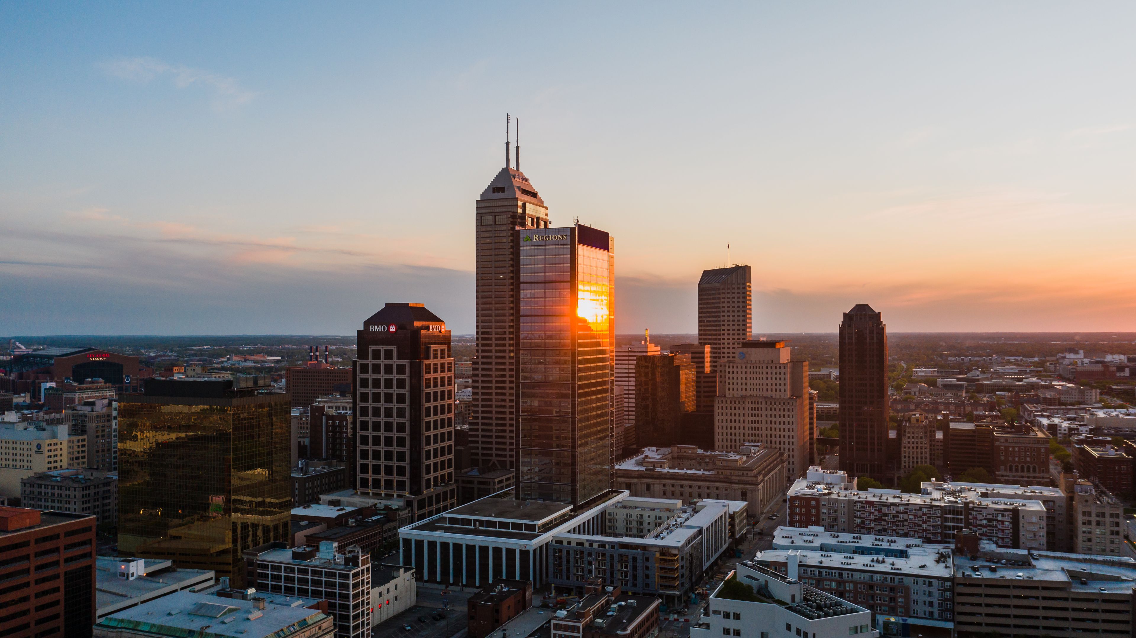 Indianapolis: A stunning aerial view of Indianapolis, Indiana's skyline at sunset