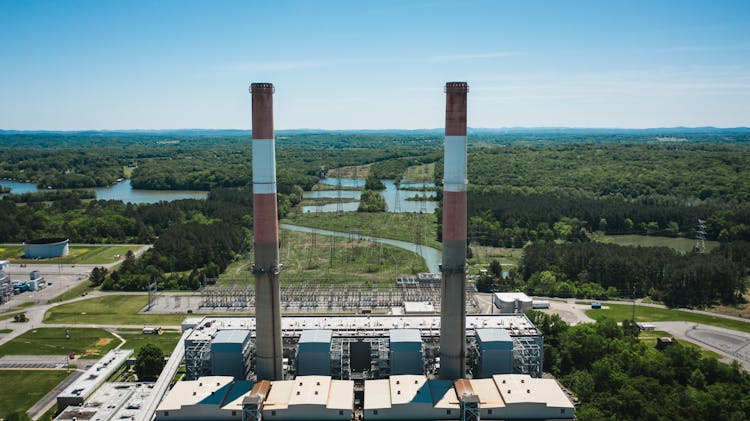 Industrial Chimneys On Power Plant Platform Under Sky