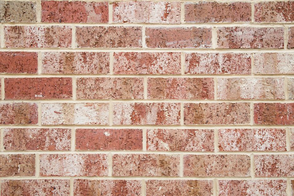 Close-up of a red and white brick wall pattern for design or background use.