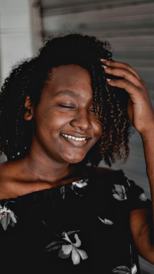 Woman in Floral Shirt Smiling