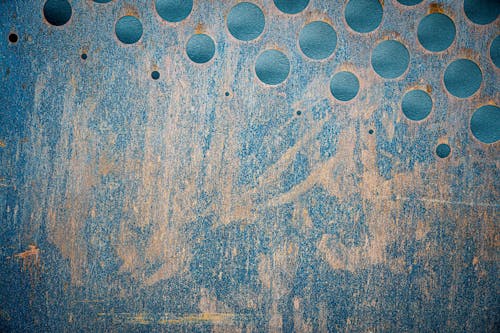 Abstract background of grunge wall with round holes