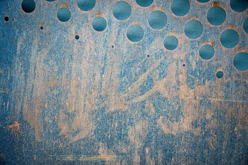 Free Abstract background of grunge wall with round holes Stock Photo