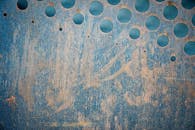 Abstract background of grunge wall with round holes