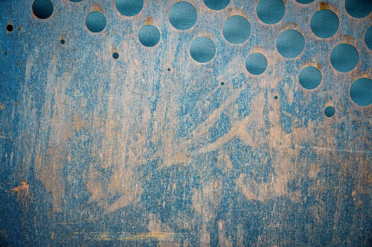 Abstract Background Of Grunge Wall With Round Holes