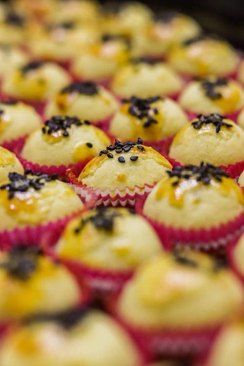 Close Up Photo of Cupcakes with Black Sesame Seeds on Top 