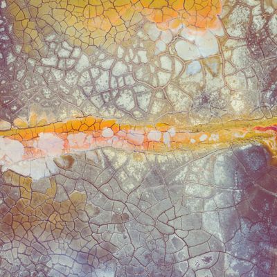 Cracked earth from above — photo by Curioso Photography on Pexels