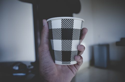 Person Holding Disposable Cup