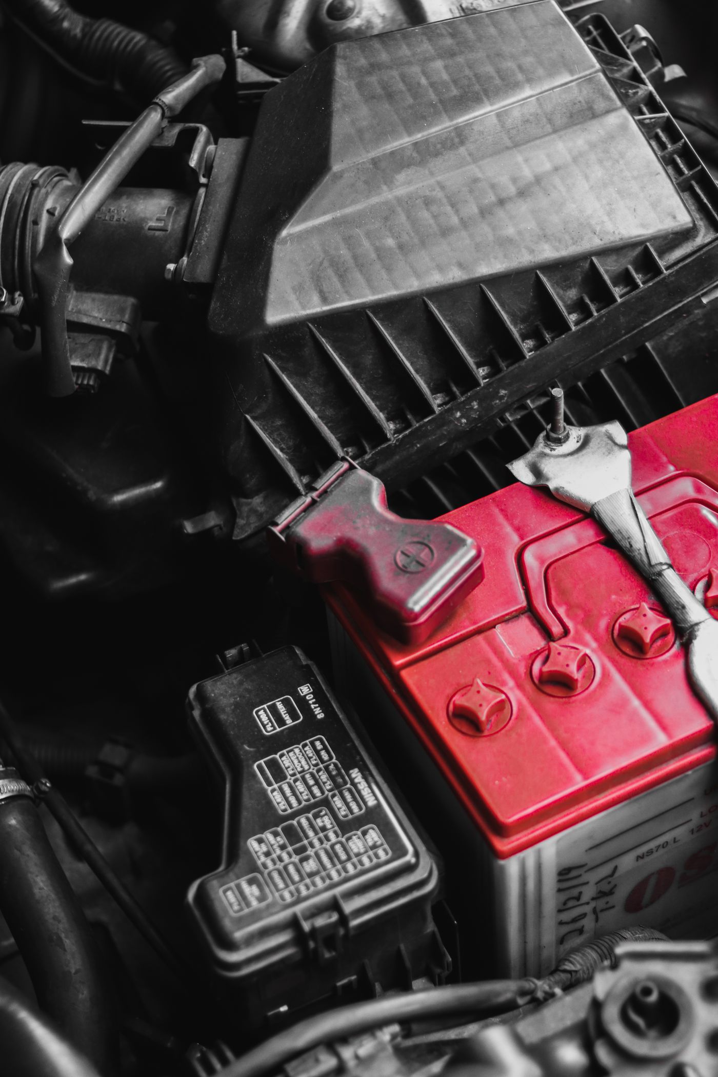 Close-up of a car battery being checked