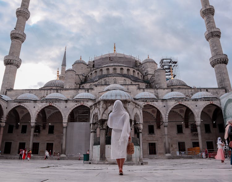 Woman Standing In Front Of Sultan Ahmed Mosque

