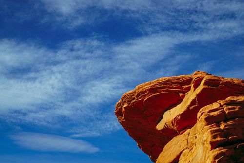 Free A striking sandstone rock formation contrasting with a vibrant blue sky, perfect for travel and nature themes. Stock Photo