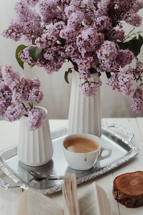 Purple Flowers in White Ceramic Vase 