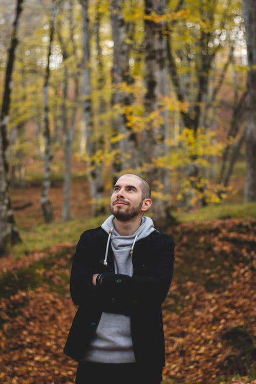 Man in Black Jacket Standing While Looking Up