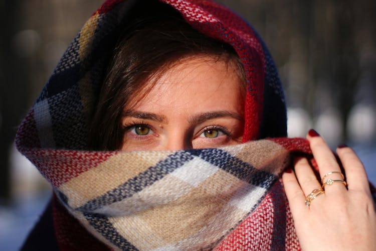 Woman Covering Her Face With Scarf