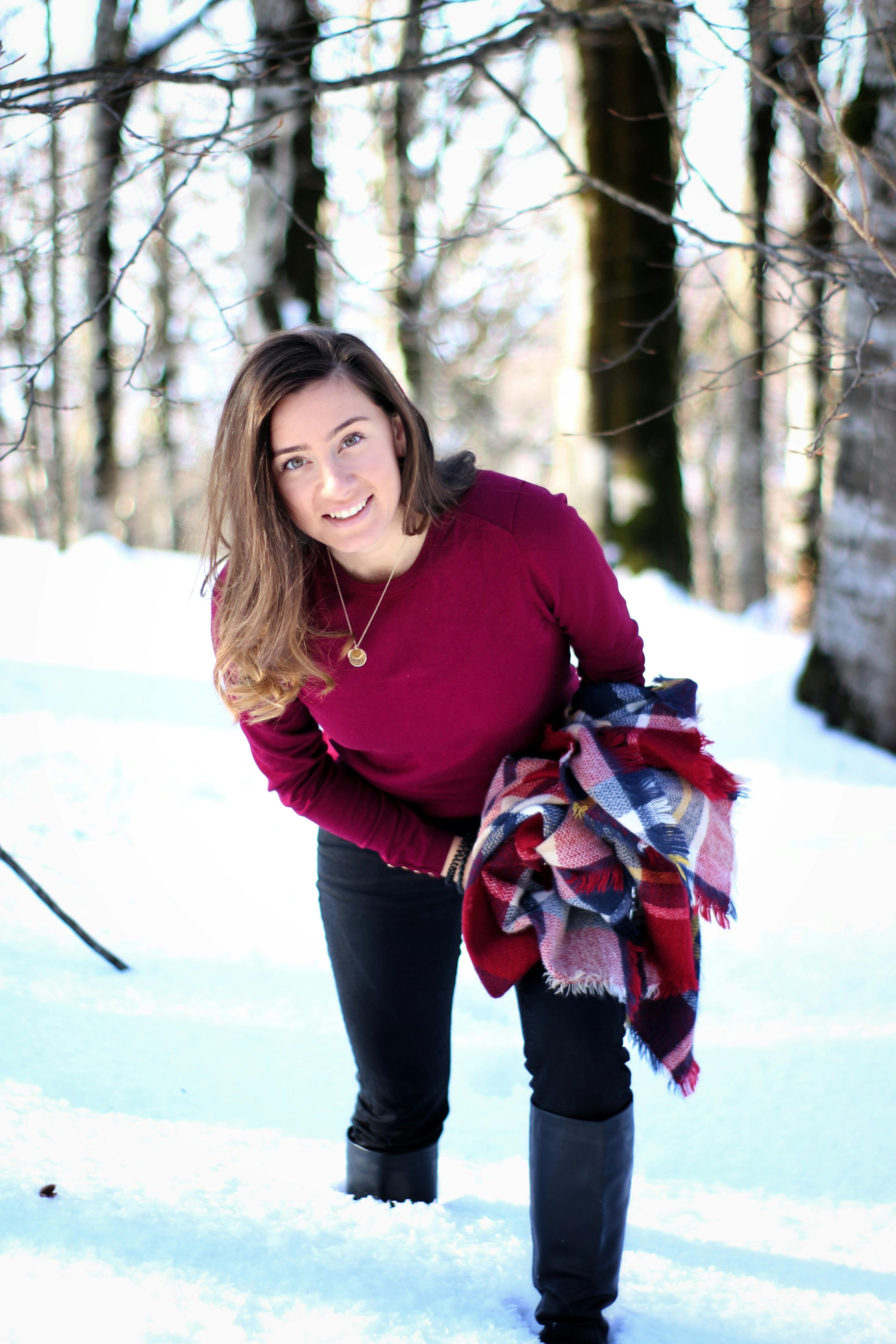 red sweater black pants