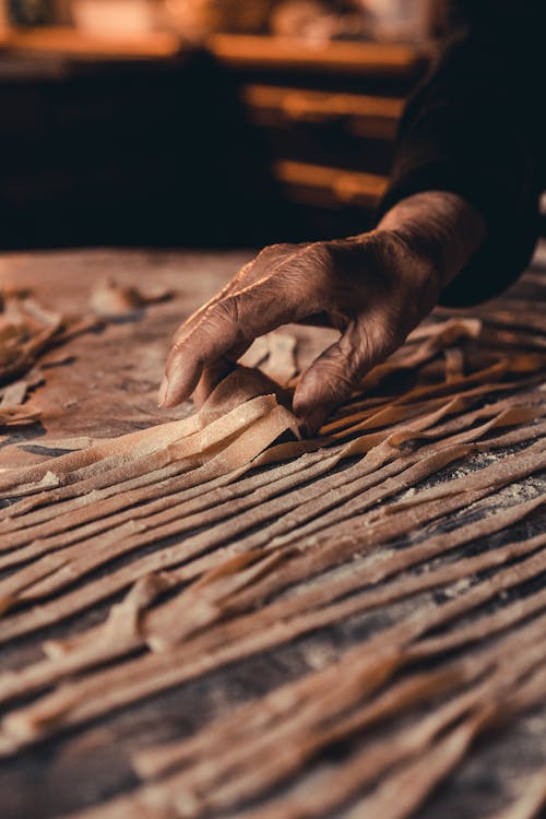 A Person Holding Pasta Noodles