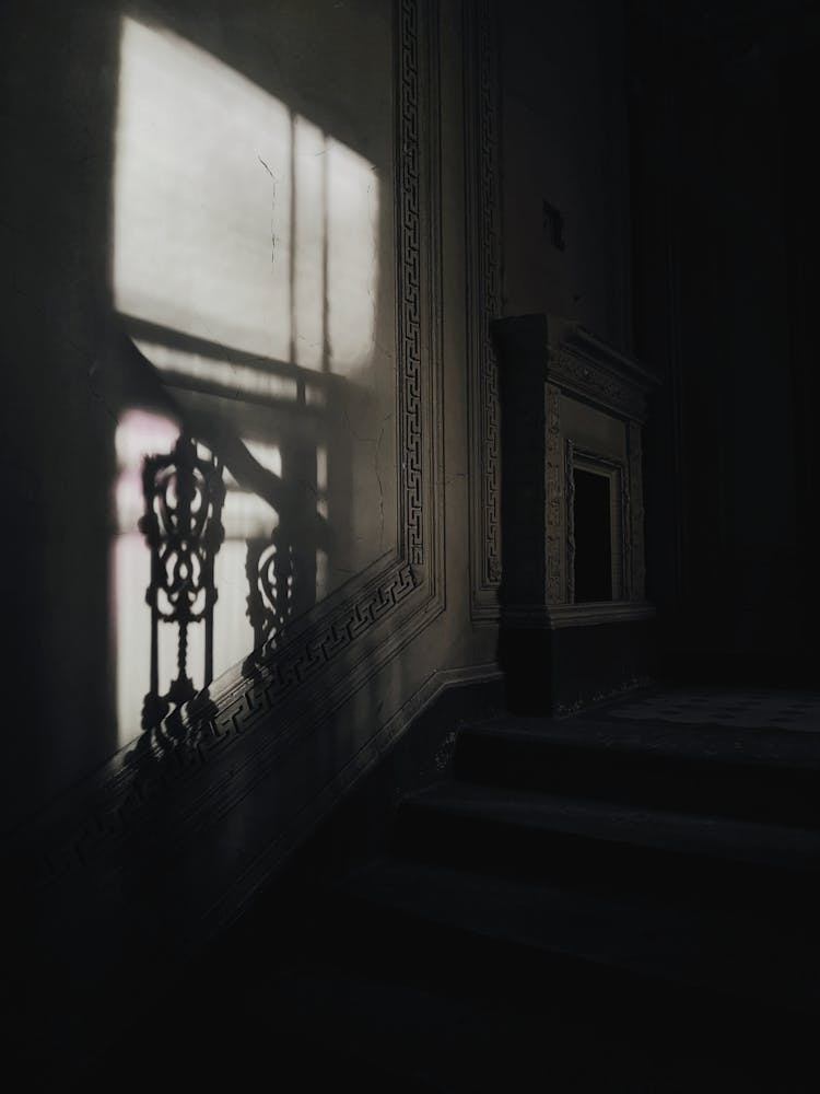 Light And Shadow On A Concrete Wall In A Dark Room