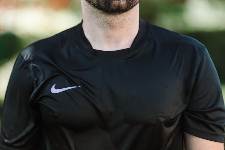 Man In A Wet Black Nike Crew Neck Shirt